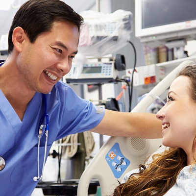 Nurse and patient smile at eachother